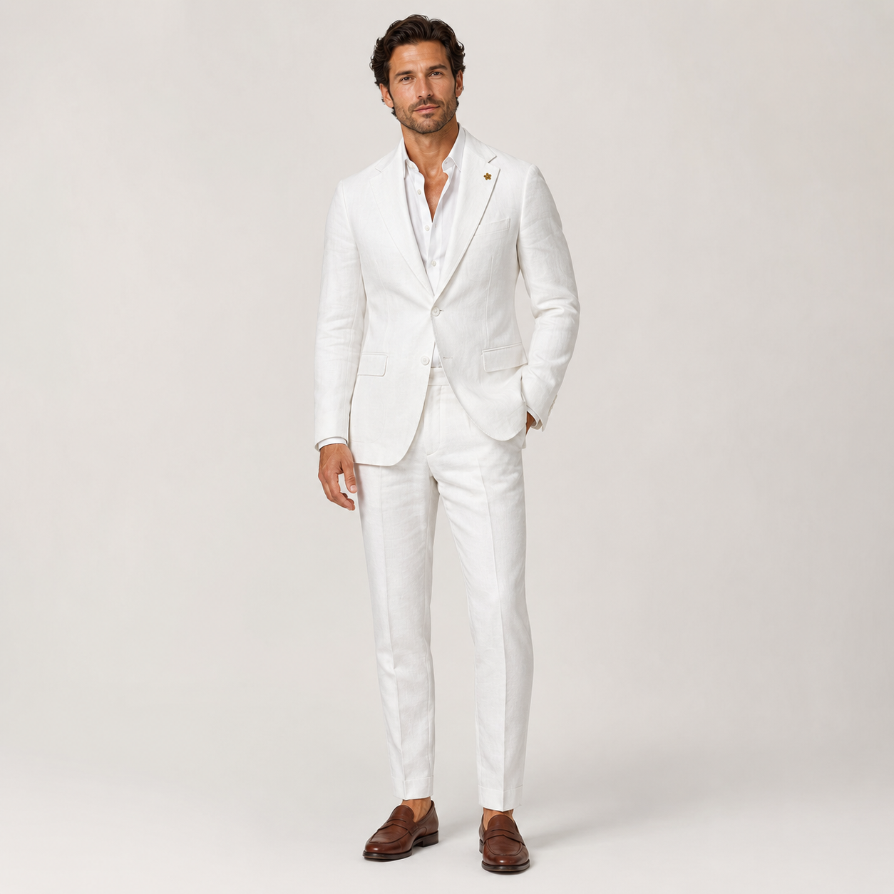Man wearing the Enzo white linen suit with notch lapels and brown leather loafers, front view