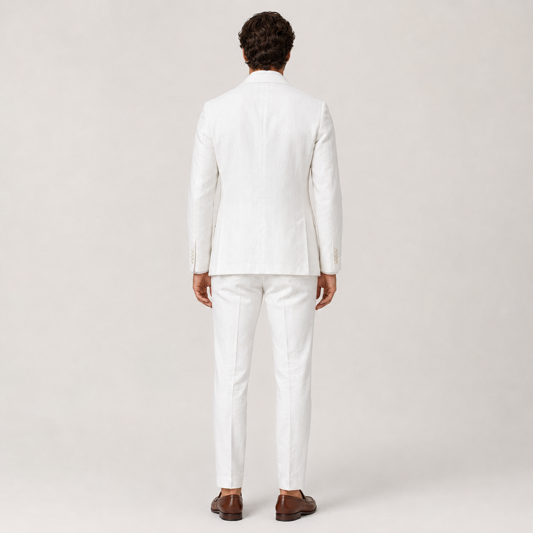 Back view of the Enzo white linen suit showing the vented jacket and tapered trousers