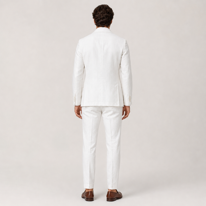 Back view of the Enzo white linen suit showing the vented jacket and tapered trousers